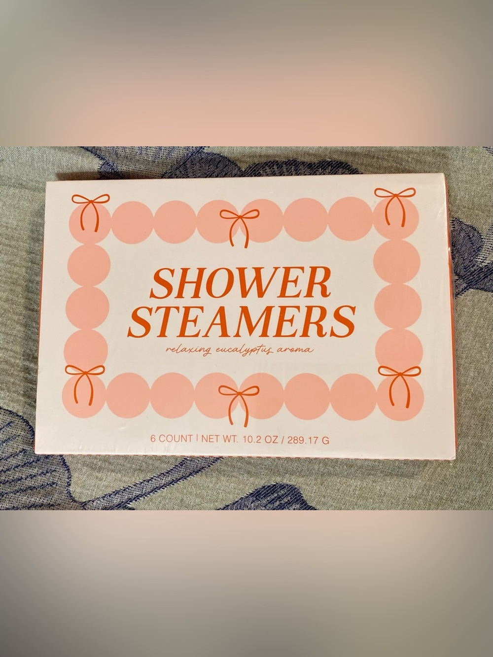 Spritz Shower Steamers in Pink and Orange Packaging